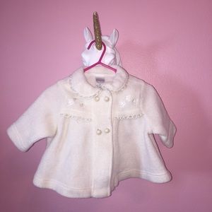 Ivory baby coat with pearl buttons